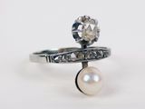 an image of a ring with a pearl and a diamond on it