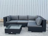 a couch and coffee table in front of a building