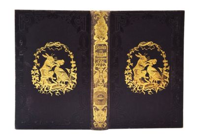 un vieux livre noir aux bords dorés, orné d'une illustration représentant deux animaux