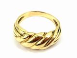 a close up of a gold ring on a white background