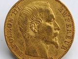 l'image d'une pièce d'or sur laquelle figure le visage d'un homme