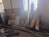 many pieces of wood sitting on the floor in a room