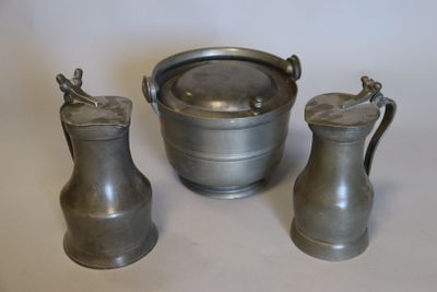 three pewwares are sitting on a white surface with a white background