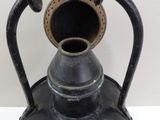 an old fashioned light that is sitting on a table