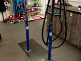 a picture of a bike repair shop with tools on the floor