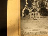 an old photo of a group of circus performers performing in front of a building