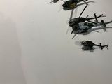 a lot of black and white helicopters on a white wall