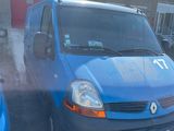 a blue van that is parked in front of a building