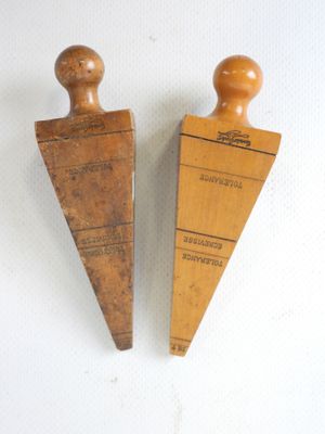 pair of vintage wooden bookends on a white background