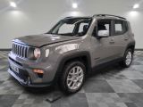 the gray jeep is parked in the garage on a checkered floor