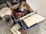 a box full of books and other items sitting on the floor
