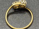 an image of a gold ring with a diamond on top of it