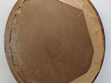 a cardboard plate with a hole in the middle of it