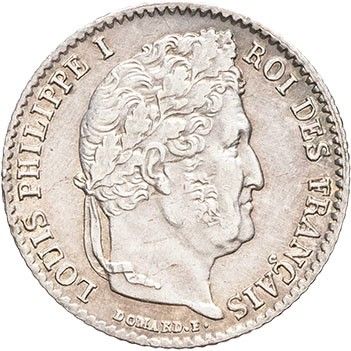 a silver coin with a man ' s head on it