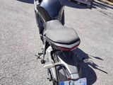 a motorcycle that is parked on the side of the road