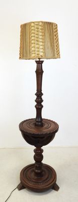 a lamp that is on top of a wooden table