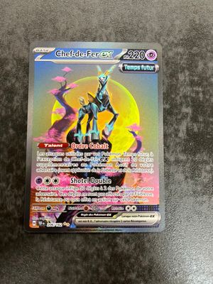 a close up of a pokemon card on a table