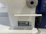 a sewing machine that is sitting on a table