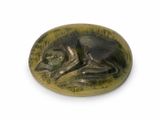 an image of a dog on a stone plaque