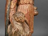 an image of a statue of a man holding a child