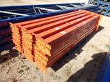 a close up of a pile of lumber sitting on top of a pile of dirt