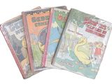 plusieurs livres pour enfants sont alignés sur une surface blanche