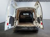 a white van with its doors open in a room