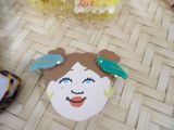 a picture of a little girl with a bird on her head