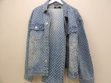 an image of a denim jacket hanging on a hanger