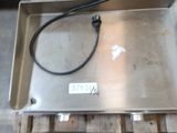 a metal box with a wire attached to it on a pallet