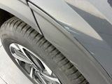 a close up of a car ' s tire on the street