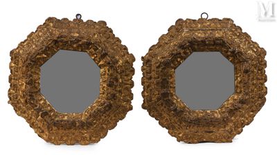 pair of antique carved wood mirrors with a gold frame