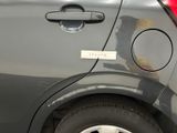 a close up of a car door handle with a sticker on it