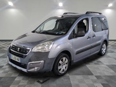 the grey van is parked on a checkered floor in a garage