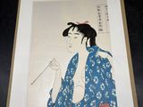 an image of a woman in a blue kimono is holding a cigarette