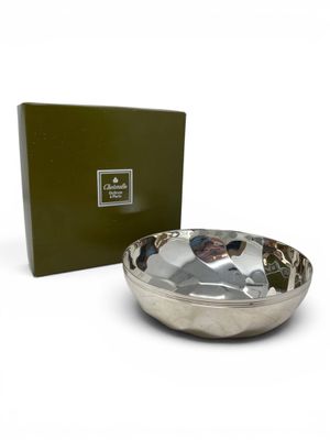 silver plate with a green box on a white background