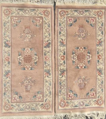 pair of antique chinese rugs with floral designs and fringes