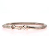 a close up of a bracelet on a white background