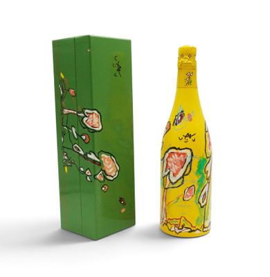 a bottle of wine that is sitting next to a box