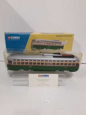 a model of a green and white train on display
