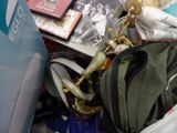 a pile of clothing and other items on the floor
