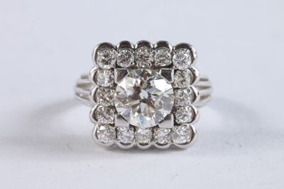 Bague en or gris 750 ‰ et platine sertie d'un diamant taille… - Photo 1