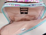 a pink and blue bag with a flower pattern inside of it