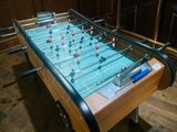a foosball table in the middle of the room
