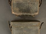 two pieces of luggage that are sitting on a table