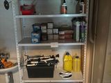 a shelf that has a lot of items on it