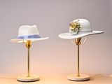 two hats that are sitting on top of a table