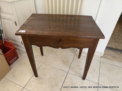 a small wooden table with a drawer on top of it