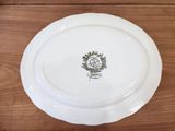 a white plate with a picture of a tree on it