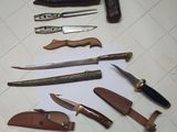 many different types of knives and knives on the table